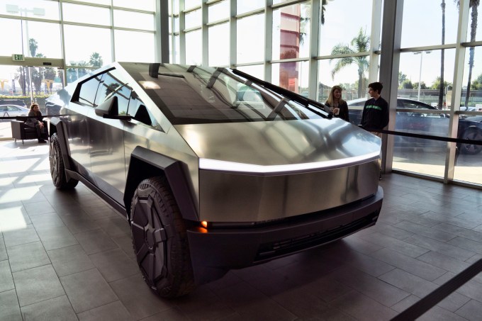 A Tesla Cybertruck is on display at the Tesla showroom in Buena Park, Calif. on Sunday Dec. 3, 2023. With manufacturing kinks still to be worked out, Tesla has delivered the first dozen or so of its futuristic Cybertruck pickups to customers. (AP Photo/Richard Vogel)