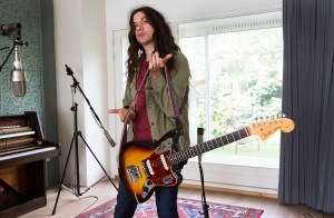 Portrait of American singer-songwriter and guitarist Kurt Vile in a studio in Amsterdam, Netherlands, 26th August 2015. He is holding a Fender Jaguar guitar. (Photo by Paul Bergen/Redferns)